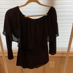 Black ruffled romper — off the shoulders